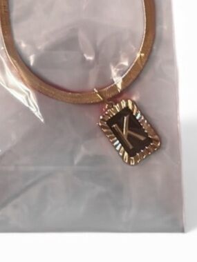 New "K" necklace faux herringbone gold tone chain New in plastic packaging